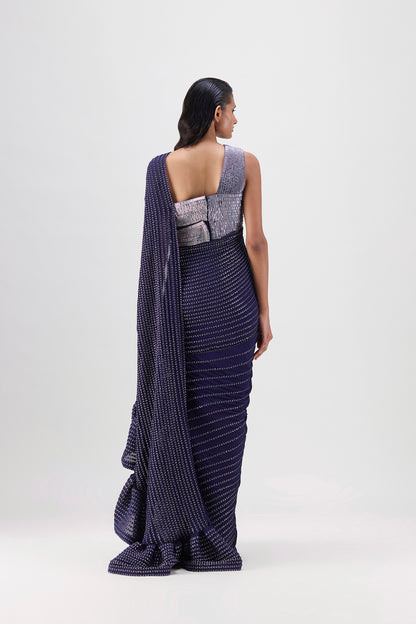 METALLIC STRUCTURED GOWN WITH RUFFLE BRAIDED DRAPE