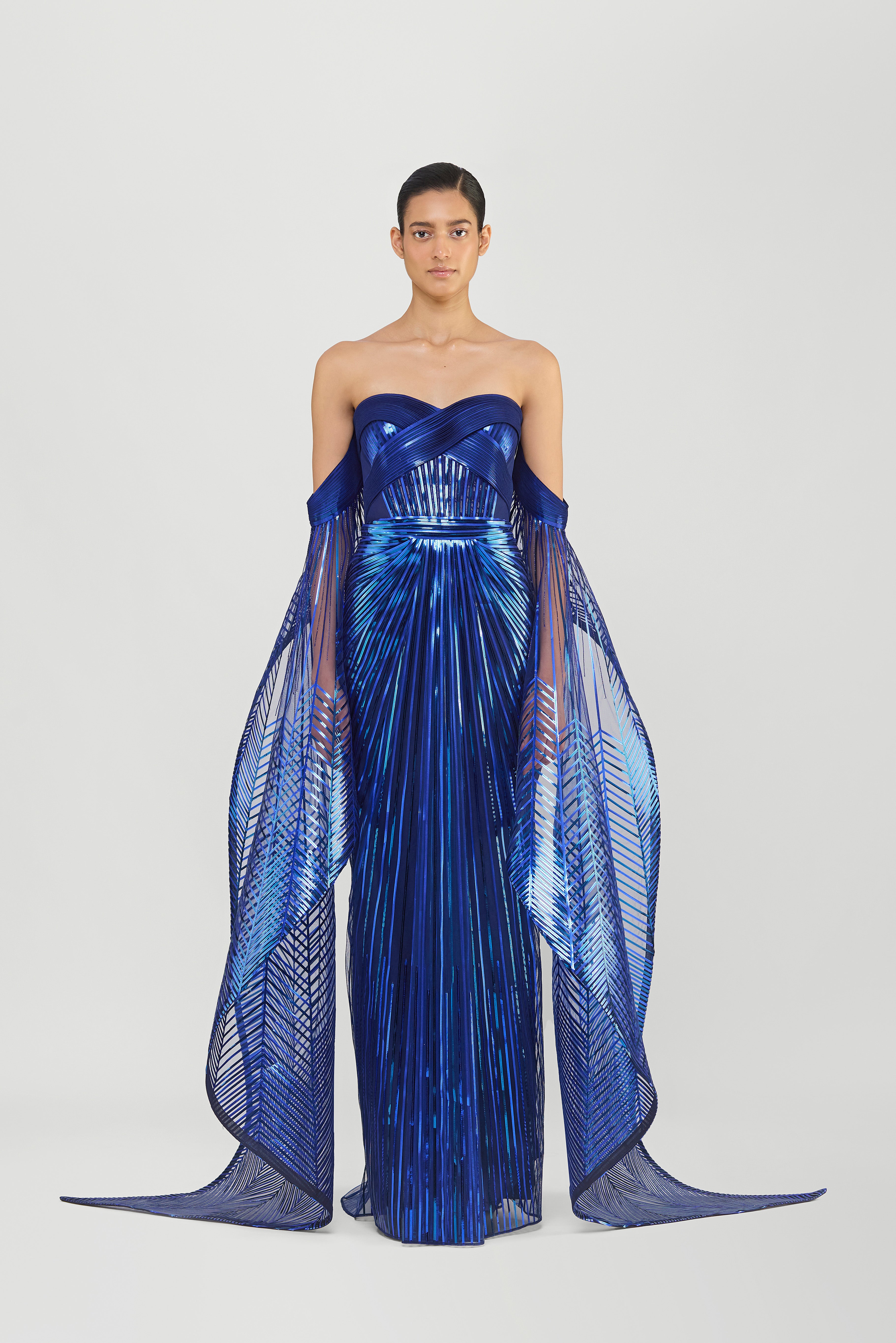 METALLIC MICROPLEATED OFF THE SHOULDER GOWN WITH SUNRAY WINGS ON SLEEVES