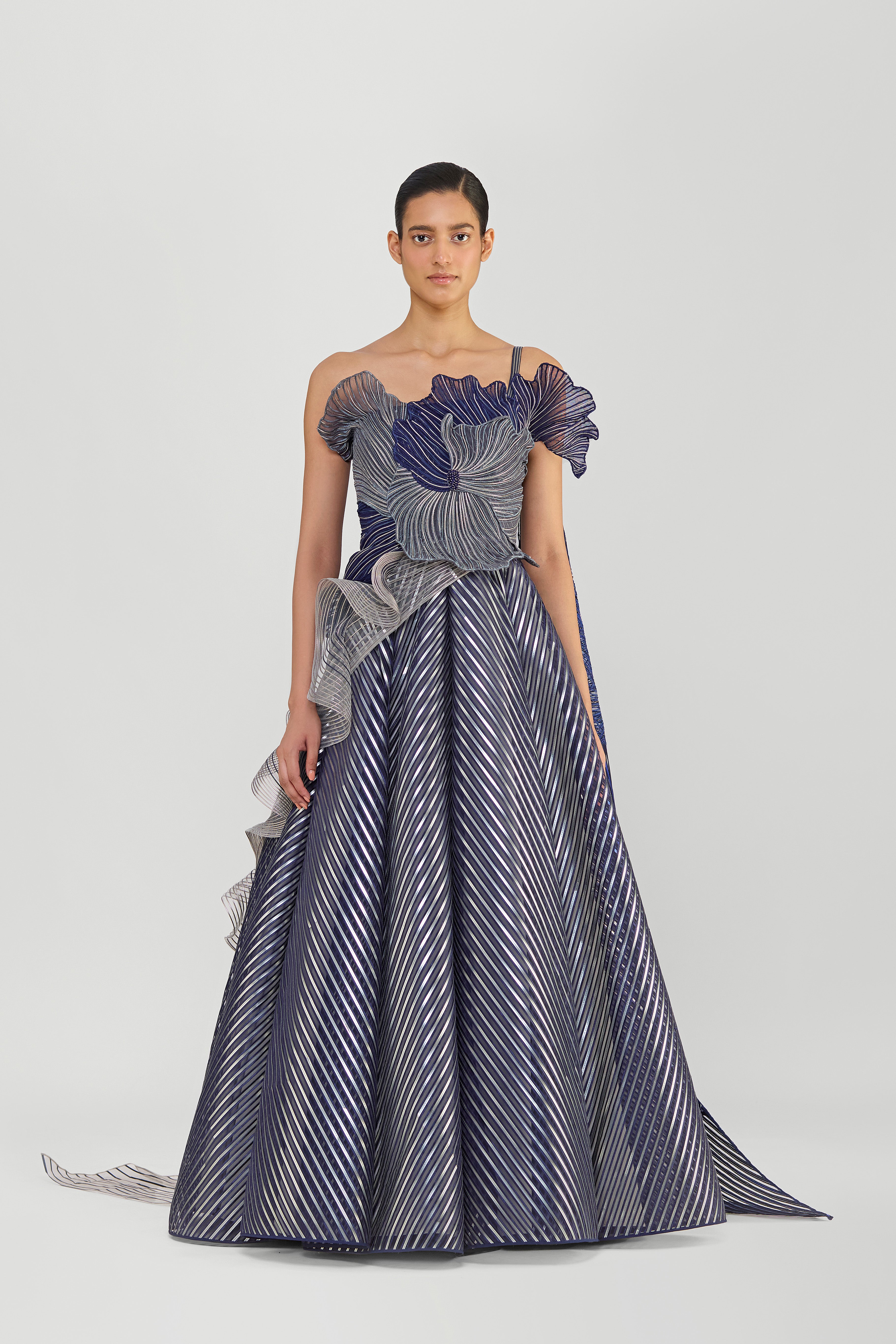 STRUCTURED CORDED CORAL OFF THE SHOULDER GOWN WITH A METALLIC FLUTED TULLE SKIRT AND TWO DRAPES