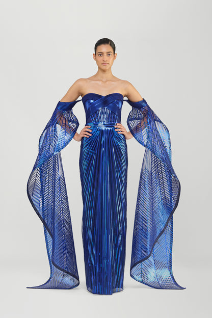 METALLIC MICROPLEATED OFF THE SHOULDER GOWN WITH SUNRAY WINGS ON SLEEVES